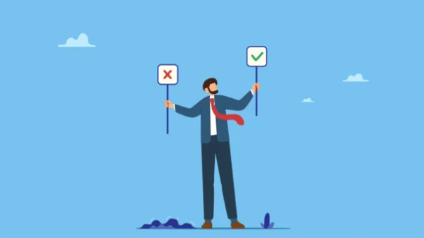 Businessman holding signs with a checkmark and a cross, symbolizing making the right choice.